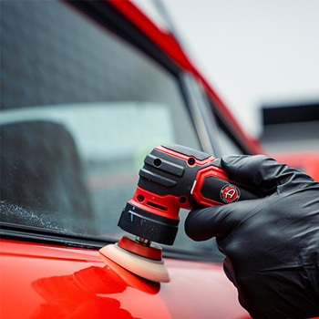 Auto Detailing Door of a Red Sports Car